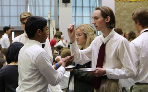 Campus Ministers distribute the Eucharist to fellow classmates during one of many bimonthly all-school Masses. 