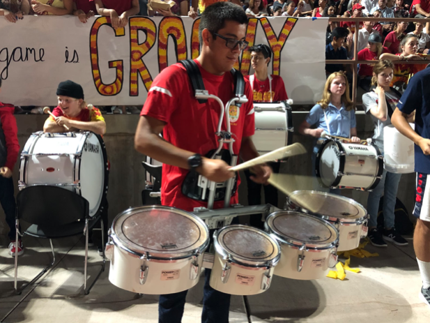 Evan Martinez ‘22 plays the drums at the recent football game against Centennial High School. CCHS beat CHS 44-41, scoring the winning touchdown in the last minute of the game.