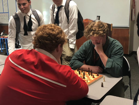 The CCHS Mock Trial team holds meetings after school on Tuesdays and Thursdays every week. Travis Miller ‘21 challenges Mr. Daniel Collins to a quick game of chess before the beginning of a Mock Trial meeting. 