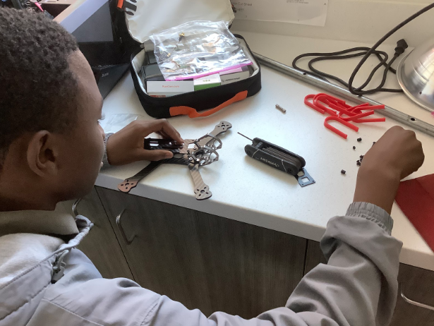 Members of RC Club are building radio controlled vehicles to use during their club meetings. RC Club president Amaree Berry ‘21 crafts a drone that will be tested with the club upon its completion. 