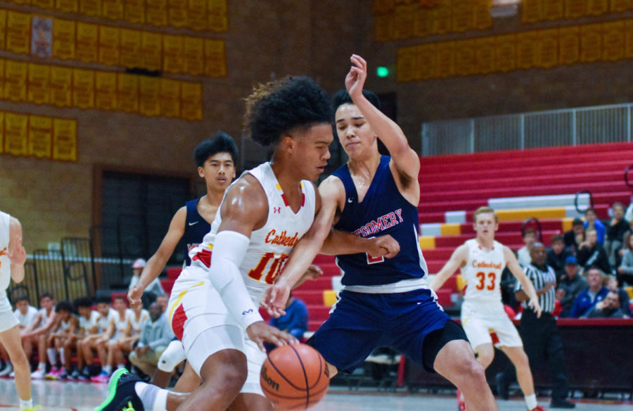 Beon Riley ‘20 dribbles down the court in a matchup against Montgomery High School.