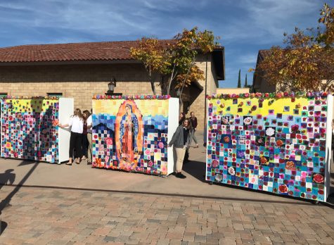 Cathedral Catholic High School students celebrate the feast day of Our Lady of Guadalupe by processing the student-made mural to the chapel during break.