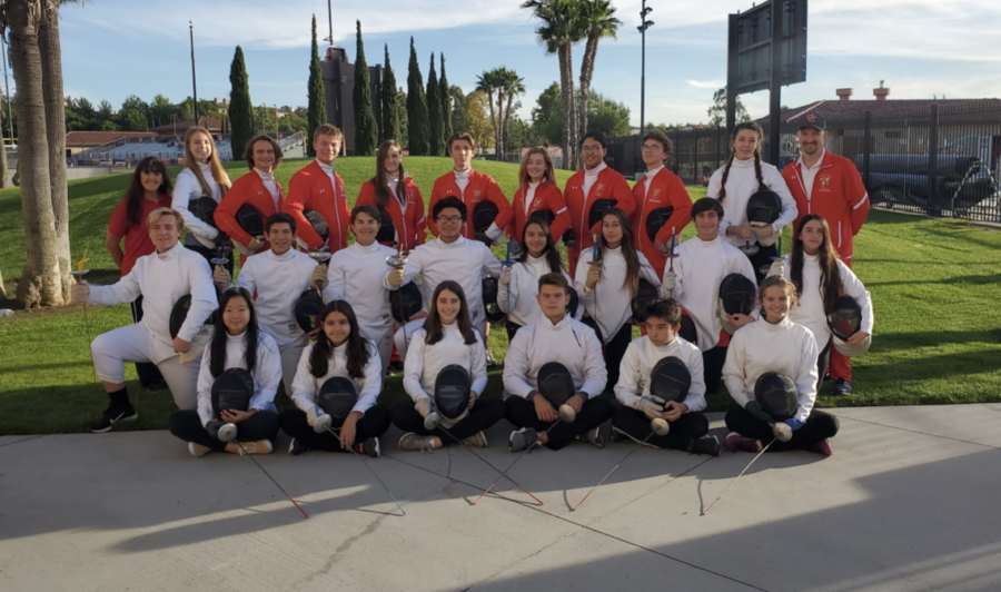The Cathedral Catholic High School fencing team lines up for team pictures in full uniform attire.