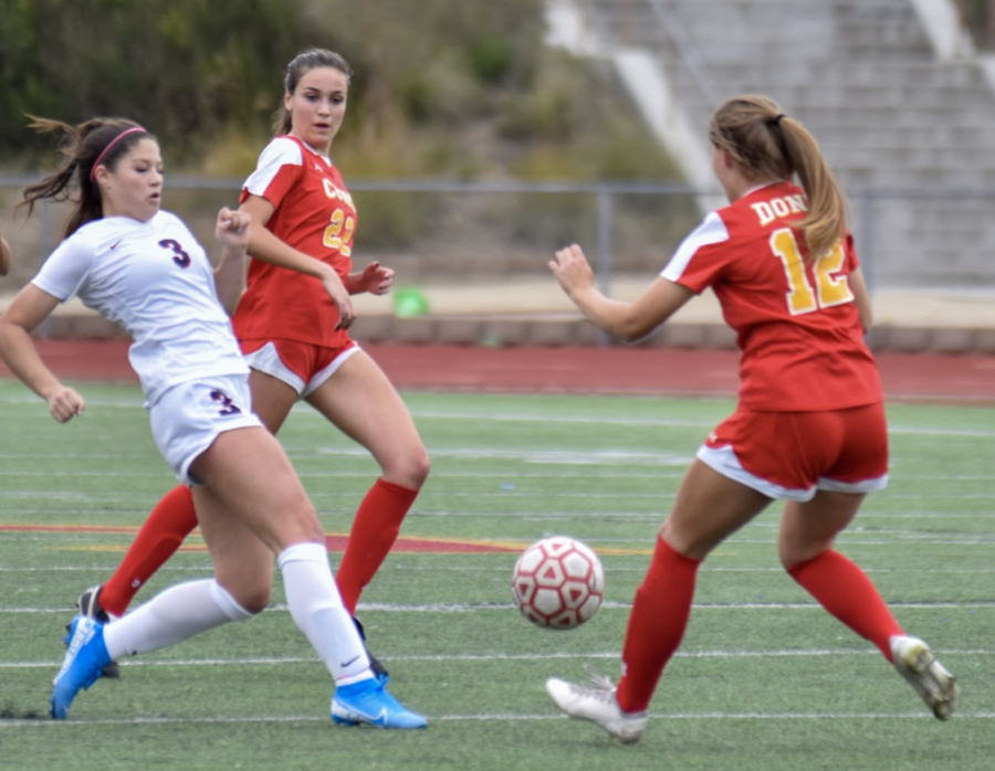 CCHS varsity soccer player Sophia Aragon ‘21 defends her opponent in the Butch Lee Memorial Tournament against St. Margarets High School, a game in which CCHS won 3-0.