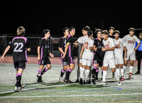 The CCHS varsity soccer team shakes hands with Canyon Crest Academy after a match.