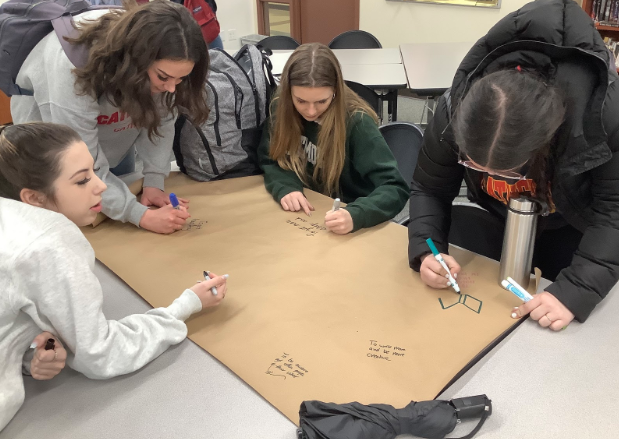 Chi Sigma Epsilon, the National English Honor Society, hosted the first “New Year, New Goals” poster writing session in order to help inspire the CCHS community by demonstrating NEHS members’ commitments for the new year. NEHS members Aubrey Filler ‘20, Madison Stoddard ‘20, Samantha Fay ‘20, and Anna Mendez ‘20 each write down their own New Year’s resolution  and decorate the poster. 
