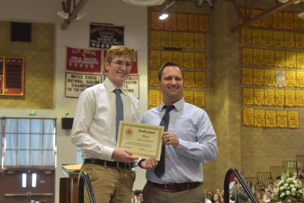 Mr. Jeff Gramme hands Matthew Kirven ‘20 the Distinguished Don award of January 2020. Kirven was nominated for his exemplary service in his service club that supports Nazareth Orphanage in Tijuana and the videos he made to raise awareness about human trafficking. 