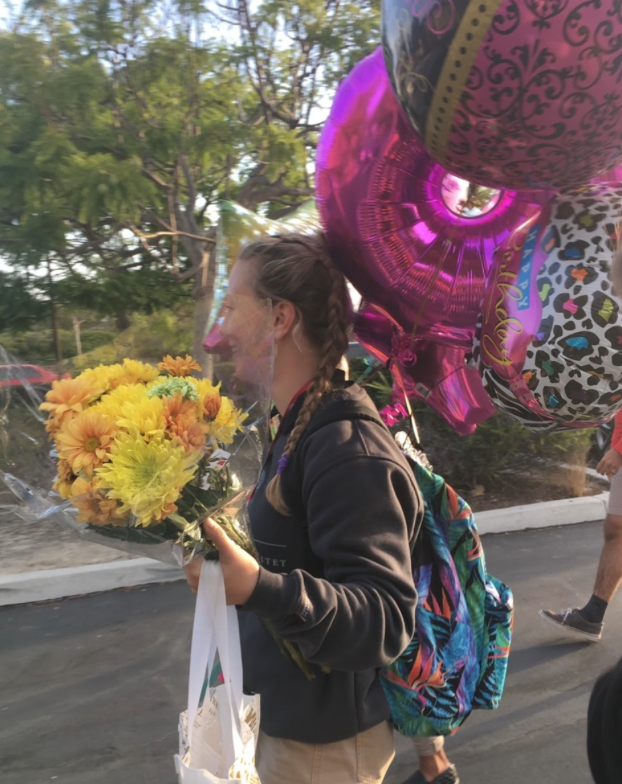 Clare Hannon ‘20 celebrates her birthday with flowers, treats, and balloons, including a large 18 to signify her coming of age. 