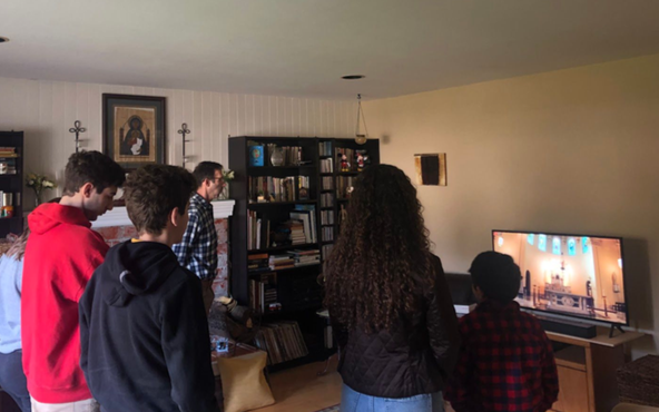 The Bacich family gathers in their living room to watch Mass together, as currently all Catholic Masses have been cancelled in light of the quarantine due to COVID-19.