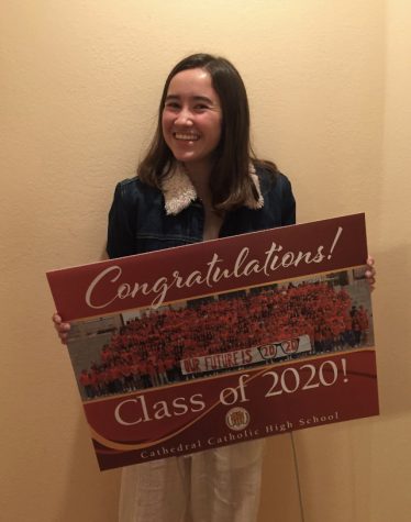 Maya Redington ‘20 poses with her senior sign, a gift from CCHS to honor the seniors as they complete their high school career at home during the COVID-19 pandemic. 
