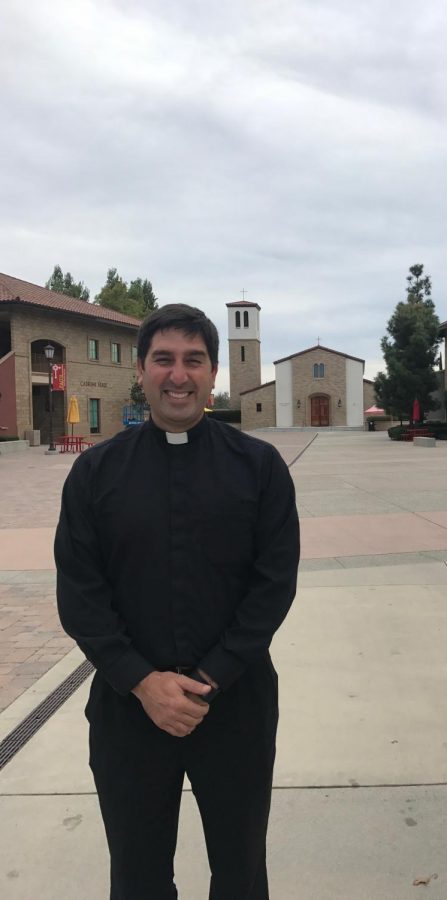 Father Martin in front of the Saint Therese Chapel on Cathedral’s campus.