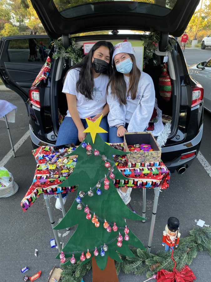 Avery+Deguzman+and+Carissa+Zamora+run+the+ironic%2C+and+fan+favorite%2C+trunk%3A+Christmas+for+Halloween.+Part+of+the+fun+at+Trunk+or+Treat+is+the+freedom+of+student+choice+when+decorating+their+trunks.+