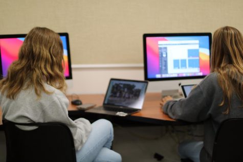 Anna Fazio, yearbook photo editor and Rylee Parker, yearbook social media editor, work on their spreads for the yearbook. Journalism and Yearbook are the closest thing CCHS has to a media communications class. 
