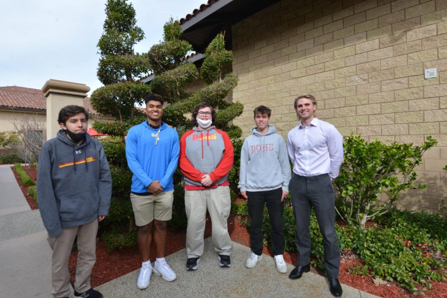 Seniors Eric Calac, CJ Burbank, Tracy Hicks, and Chase Durnin who placed in the SIFMA Foundation Stock Market Game photographed with Mr. Murphy. 