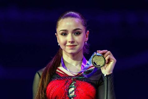 Russias Kamila Valieva poses as she celebrates winning the gold medal for the womens competition at the Rostelecom Cup 2021 ISU Grand Prix of Figure Skating in Sochi on November 28, 2021. (Photo by Dimitar DILKOFF / AFP) (Photo by DIMITAR DILKOFF/AFP via Getty Images)