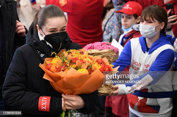 TOPSHOT - Russias figure skater Kamila Valieva walks upon her arrival from China at the Sheremetevo airport outside Moscow, on February 18, 2022. - The sport has been under intense scrutiny at the Beijing Olympics after 15-year-old Russian prodigy Kamila Valieva was allowed to compete despite failing a drugs test before the Games, with her youth cited as a factor in the decision. (Photo by Alexander NEMENOV / AFP) (Photo by ALEXANDER NEMENOV/AFP via Getty Images)