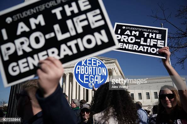 WASHINGTON, DC - JANUARY 19:  Pro-life activists try to block the sign of a pro-choice activist during the 2018 March for Life January 19, 2018 in Washington, DC. Activists gathered in the nations capital for the annual event to protest the anniversary of the Supreme Court Roe v. Wade ruling that legalized abortion in 1973.  (Photo by Alex Wong/Getty Images)