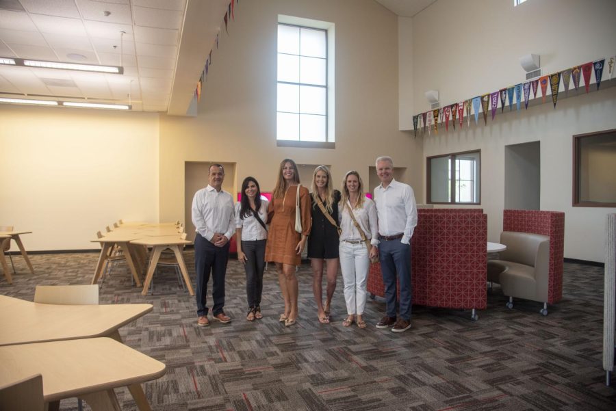 Dr. Calkins and the donors of the Academic Center stand inside the newly opened Academic Center. The space was carefully planned to maximize student collaboration, creativity, and work productivity.