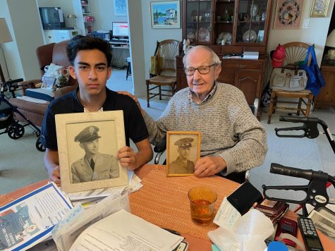 Interviewer Massimo Rigoli and World War II veteran Anthony “Tony” J. Glaser alongside old pictures of the veteran. In this interview, the two discussed the opinions, experience, and memories that  Mr Glaser has formed over the years.