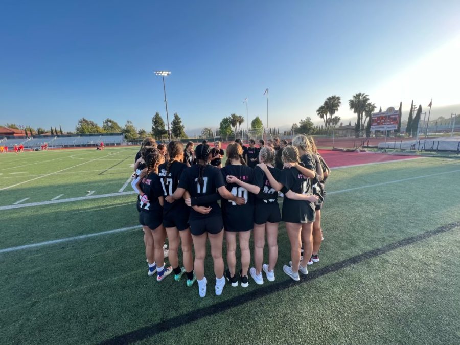 Girls+huddling+up+before+the+big+game+of+Powderpuff+where+they+are+excited+to+be+coached+by+peers+and+coaches+at+CCHS.+From+senior%2C+Cassidy+Smith%2C+she+explains%2C+%E2%80%9CIt%E2%80%99ll+be+a+really+fun+memory+for+my+last+year+of+high+school+with+all+of+my+girl+friends.+We+are+going+for+the+win%21%E2%80%9D
