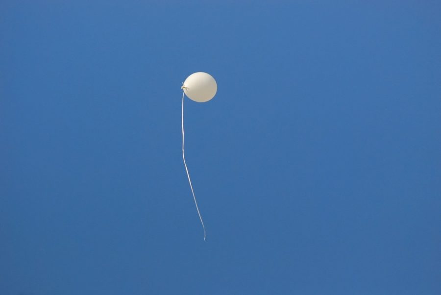 White Balloon flies up into air. Not the actual balloon in Montana.
