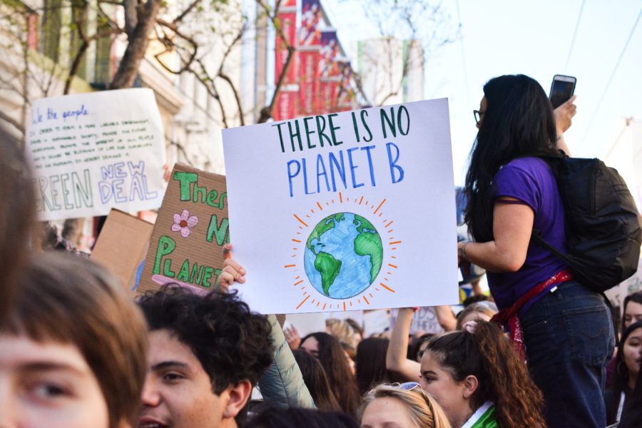 A protester holding a “There is no planet B” poster to shed like on our lack of environmentally conscious decisions. Protesters gather to protest many environmental issues much like the recent train derailments.