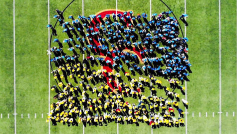 Students from Cathedral last year, 2022, gathering on field to recreate the Ukrainian flag to show support.