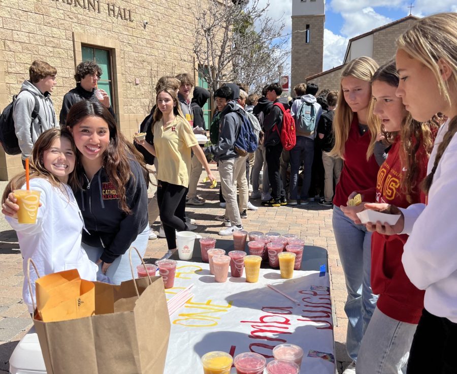Karla Hernandez ‘23 and Maddy Thomson ‘24 sell Jamba Juice to students during Wednesday of Yellow Ribbon Week. Their Together as One Club was one of many CCHS clubs who fundraised during the Club Carnival celebration.