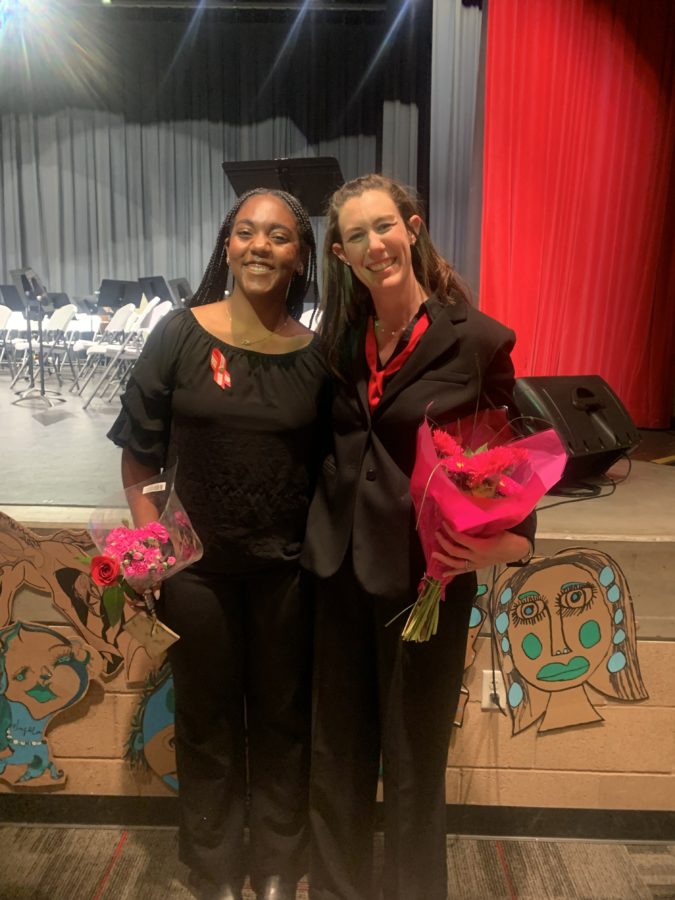 Orchestra student Kelli Jackson posing with teacher Mrs. Swift after the school spring concert.