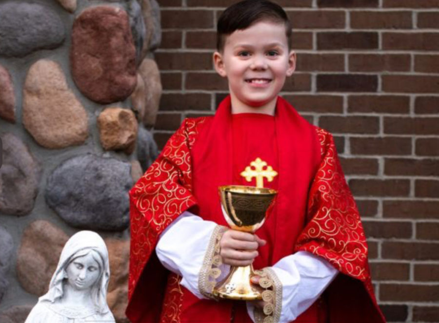 Teddy Howell, the 9 year old podcast creator dressed up as a priest, his dream occupation. This young third grader describes how when he grows up, he wants to be like Schmitz and be a priest at his local church in Michigan.