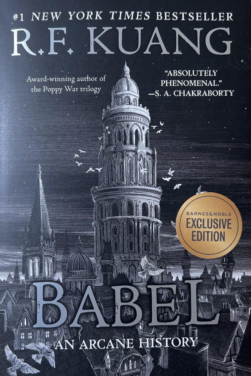 Babel+is+a+historical+fantasy+novel+written+by+New+York+Times+Bestselling+Author%2C+R.F.+Kuang.+The+cover+features+the+Oxford+Translators+Institute%2C+standing+alone+in+dominance+above+the+background+of+the+campus.