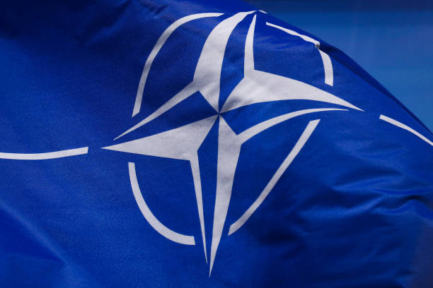 The most recent flag/logo that NATO currently uses.
