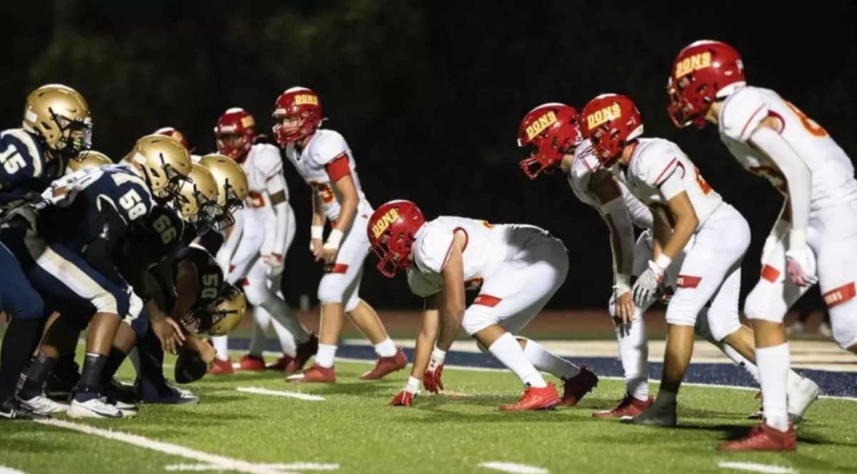 The Dons Varsity Football team takes on Mater Dei while transfers sit and watch on the sidelines.

Photo by John Fraser