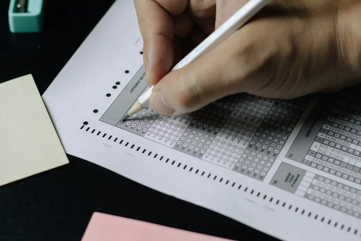 A student carefully fills in answer bubbles, capturing the familiar routine of standardized test-taking.

Photo by Nguyen Dang Hoang Nhu on Unsplash