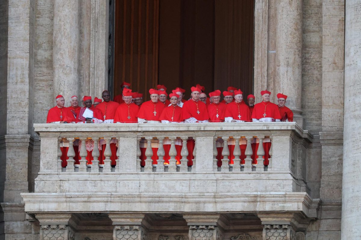 Cardinals stand on a balcony, after U.S. Cardinal Robert Prevost was elected Pope Leo XIV by the conclave, at the Vatican, May 8, 2025.REUTERS/HANNAH MCKAY