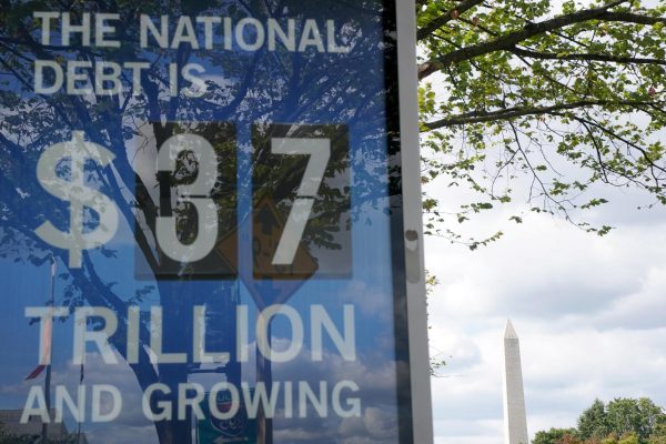 A sign at the National Mall shows the national debt following a partial government shutdown in Washington, D.C., U.S., October 2, 2025